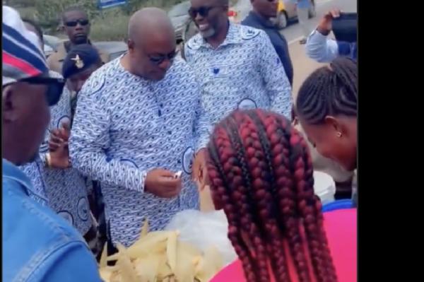 Crowds Cheer as Mahama Stops by Roadside to Buy Boiled Corn