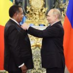 Russian President Vladimir Putin hands over the Order of Honor to Congolese President Denis Sassou Nguesso